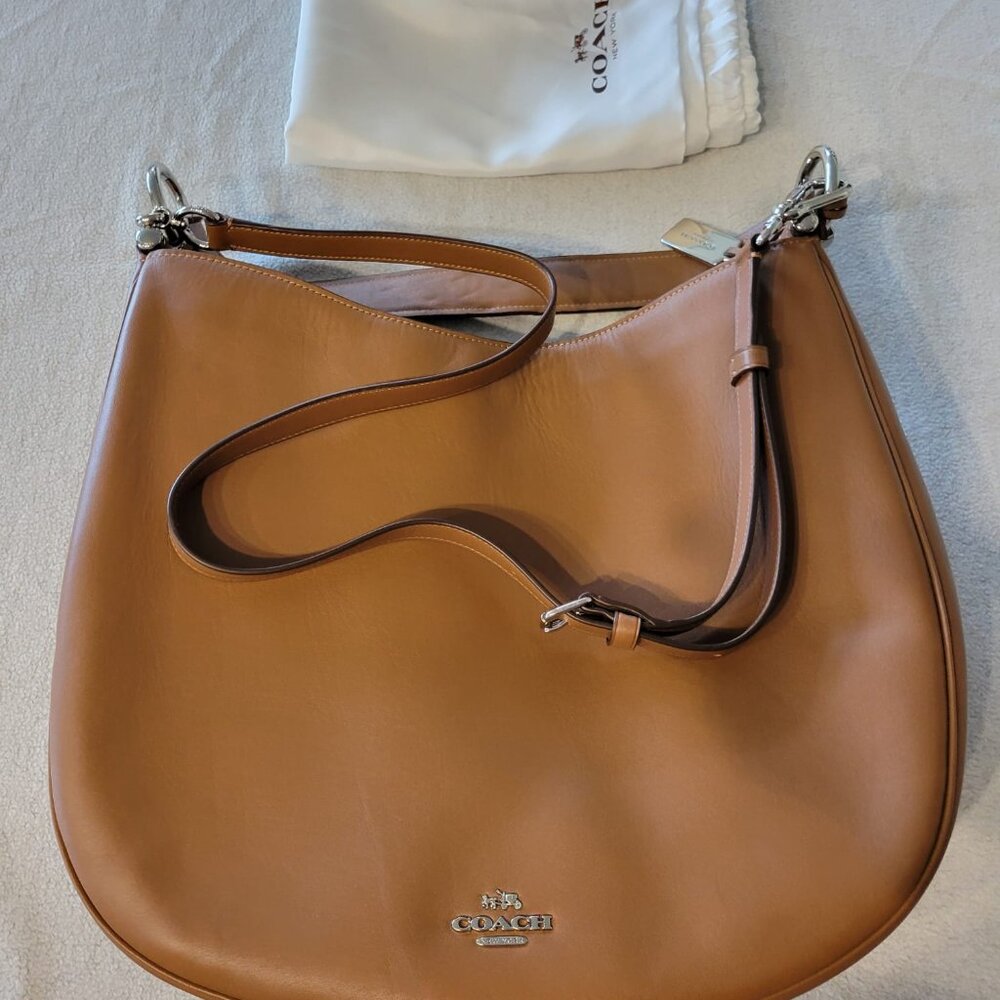 Coach Nomad Hobo In Glovetanned Leather In Saddle Brown with silver hardware.